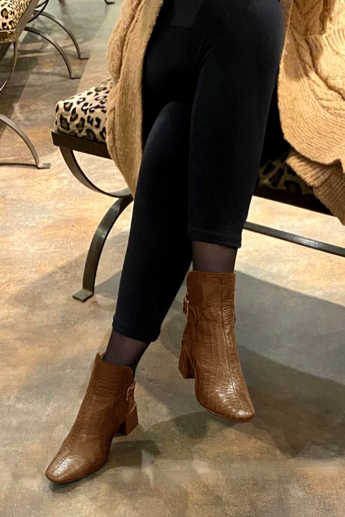 Caramel brown women's ankle boots with buckles at the back. Square toe. Medium block heels. Worn view - Florence KOOIJMAN